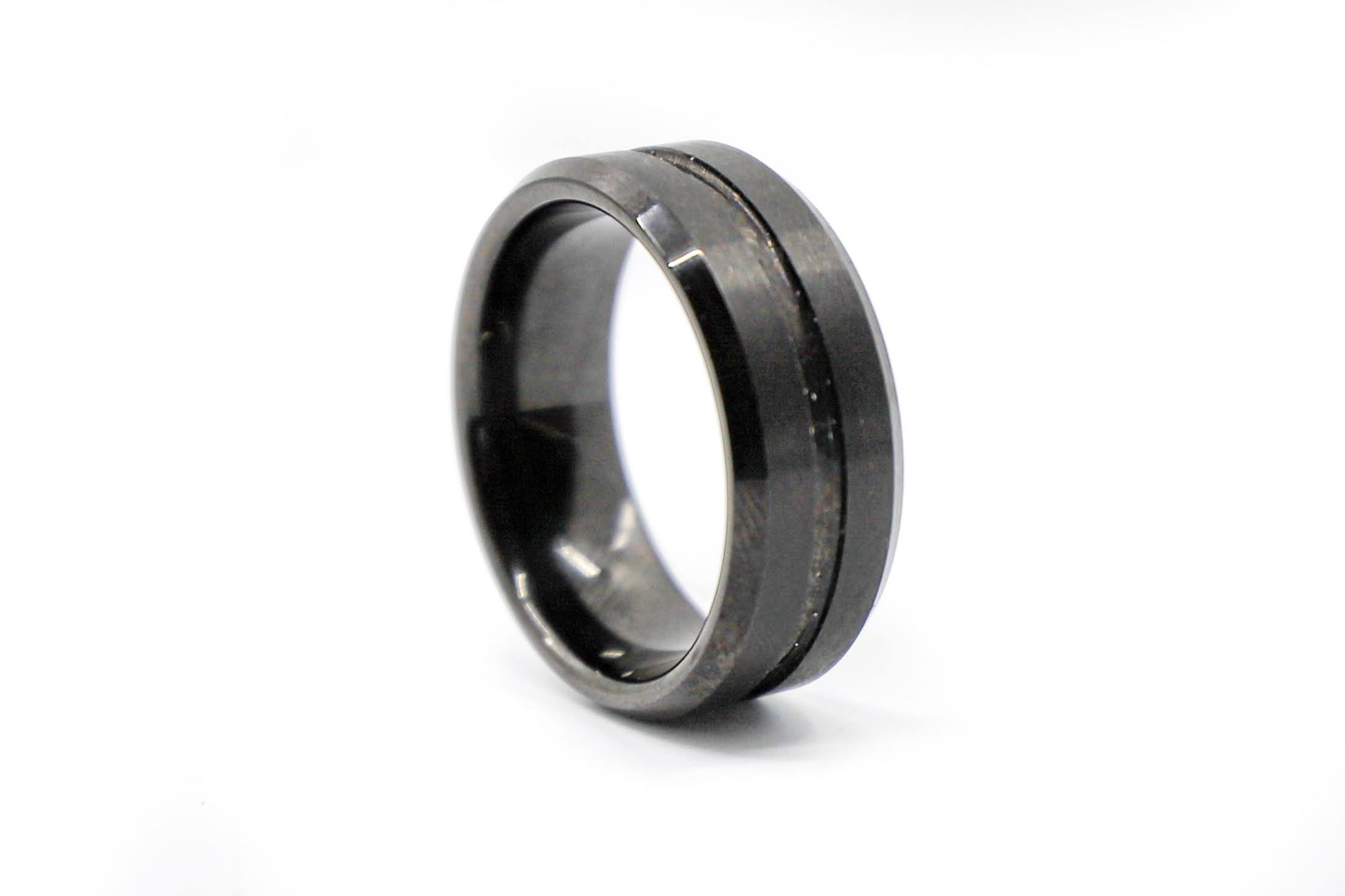 solid black wedding ring with embossed stripe