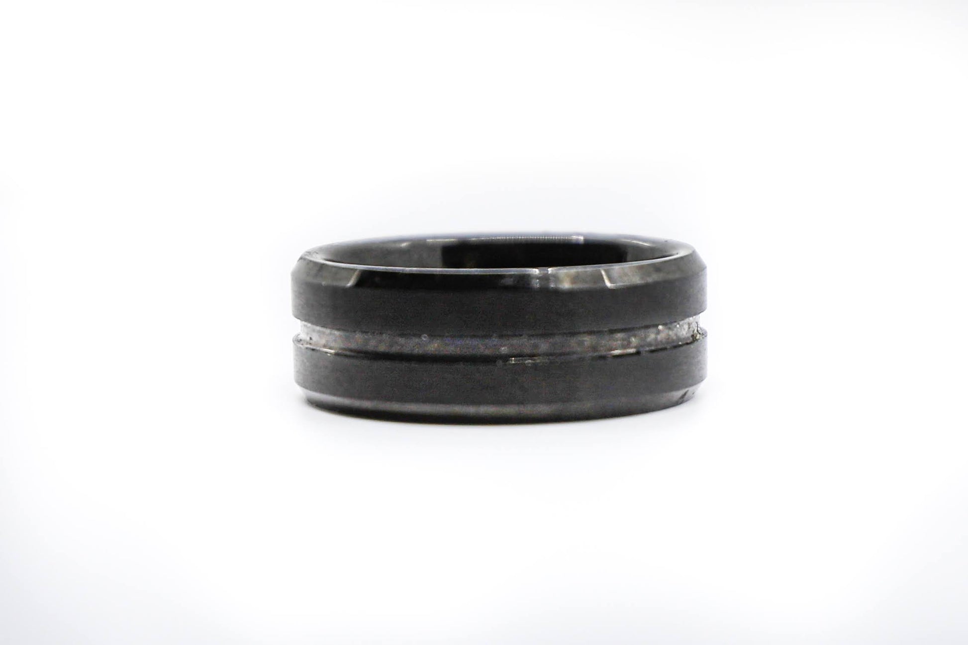 solid black wedding ring with embossed stripe